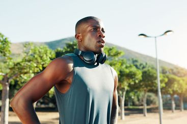Outdoor, black man and rest with thinking for fitness,...