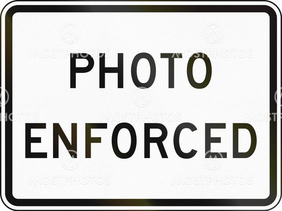 United States MUTCD road sign - Traffic laws photo enforced