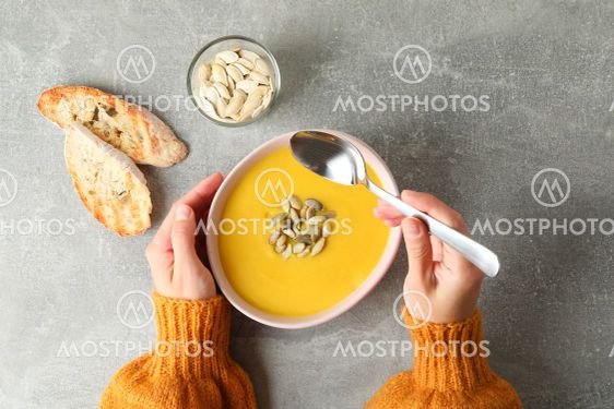 Concept of tasty eating with pumpkin soup, top view