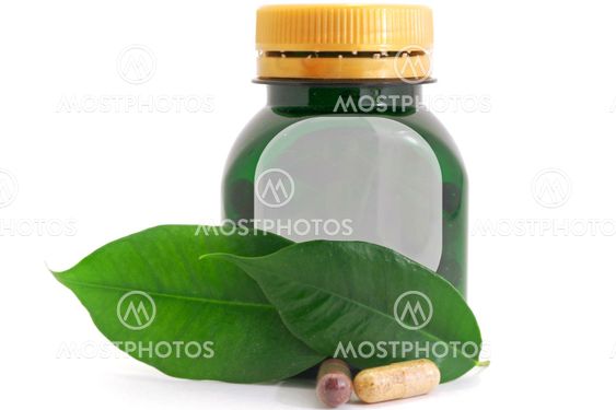 Capsules Pills Bio and Bottle with green leaf