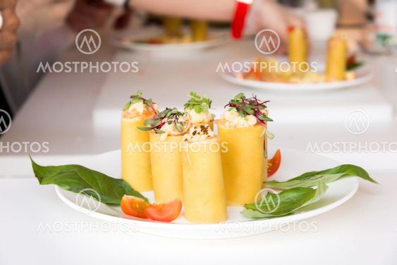 appetizer - cheese rolls with meat and vegetables