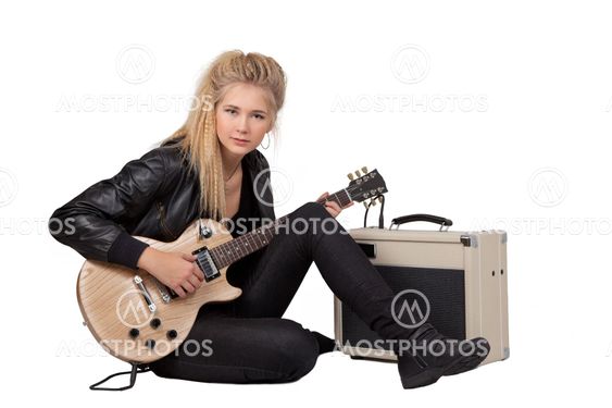 Rock Girl Playing An Electric Guitar