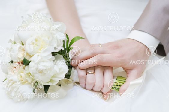 Bride and groom's hands