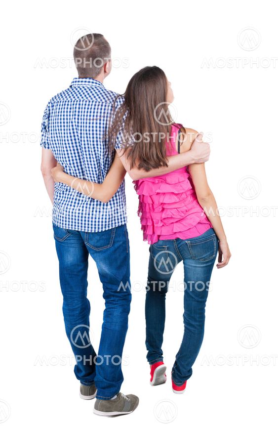 young couple pointing at wal