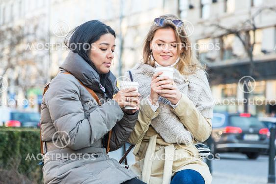 Two Young Women with Hot Beverage