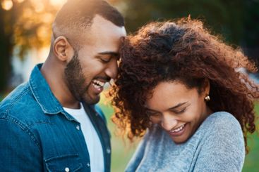Happy, love and couple in park laugh together for...