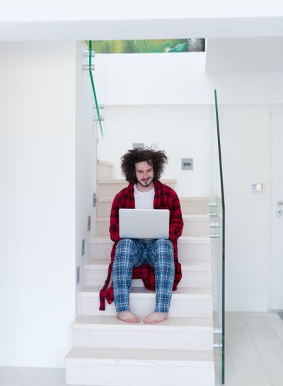 freelancer in bathrobe working from home
