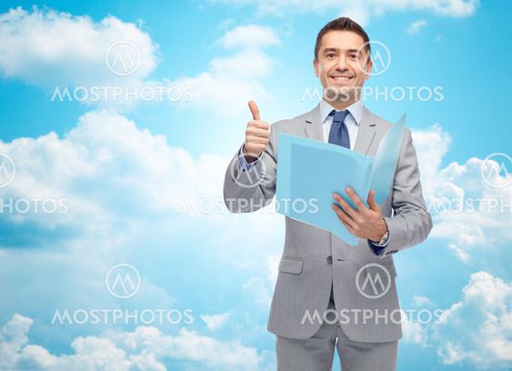 happy businessman with folder showing thumbs up