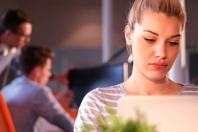 businesswoman using a laptop in startup office