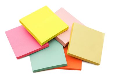 Block of vibrant multicoloured Post it Notes isolated on...