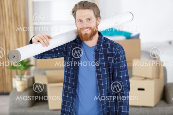 man is carring a wallpaper