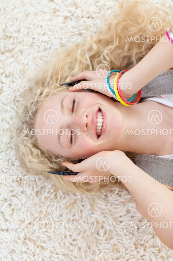 High angle of teen girl listening to music