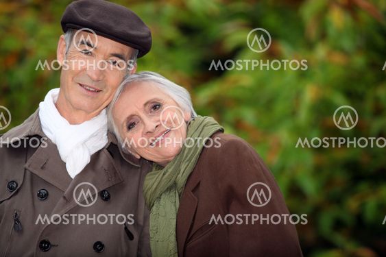 A mature couple in a park.