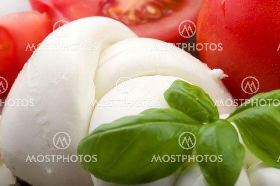 Mozzarella tomatoes and salad