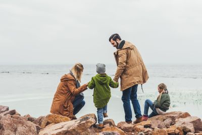 family spending time on seashore