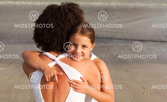 ortrait of a beautiful Daughter Hugging her mother