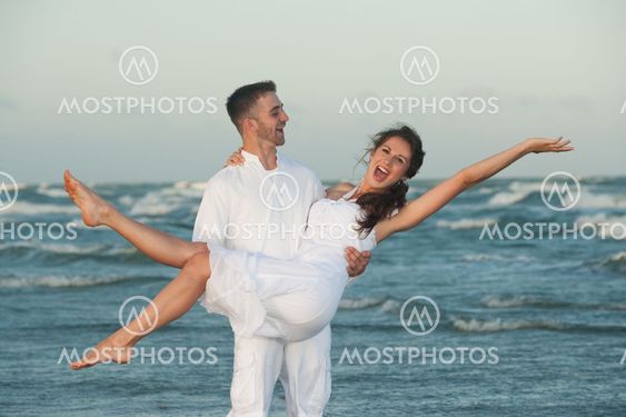 Happy man holding smiling woman