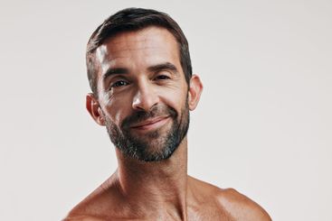 Portrait, pride and man for skincare in studio of...