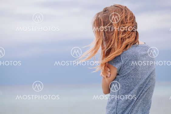 Woman alone and depressed at seaside