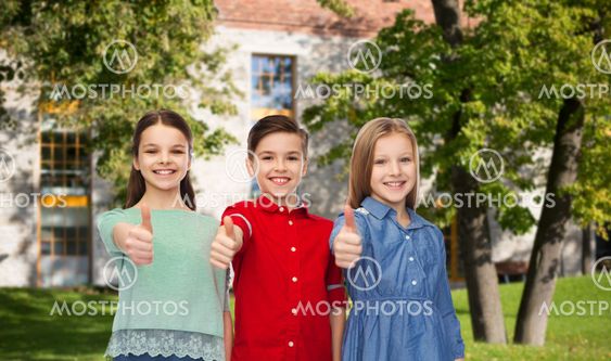 happy boy and girls showing thumbs up
