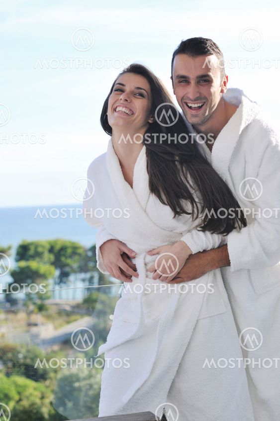 couple relaxing on balcony
