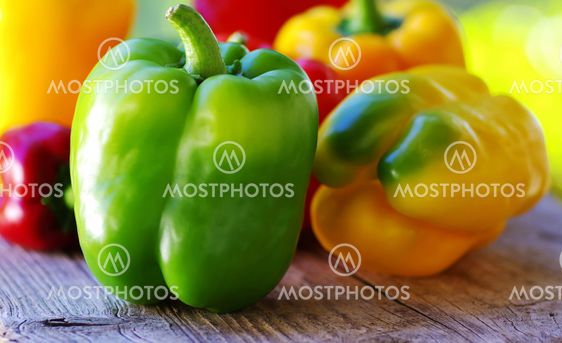 yellow, red, green peppers on table