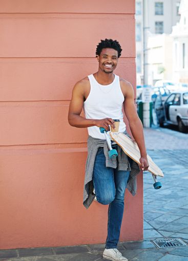 Portrait, skateboard and man with coffee in city for...