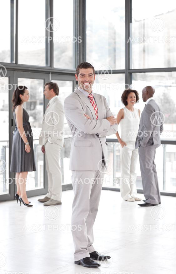 portrait of a joyful manager leading his team