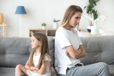 Angry mother and child girl not talking after fight