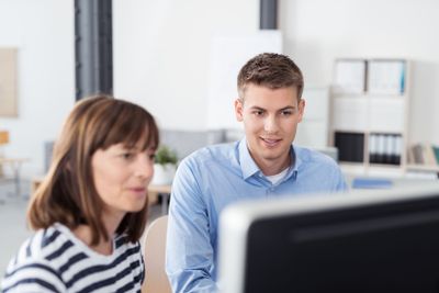 Business People Reading Something on Computer