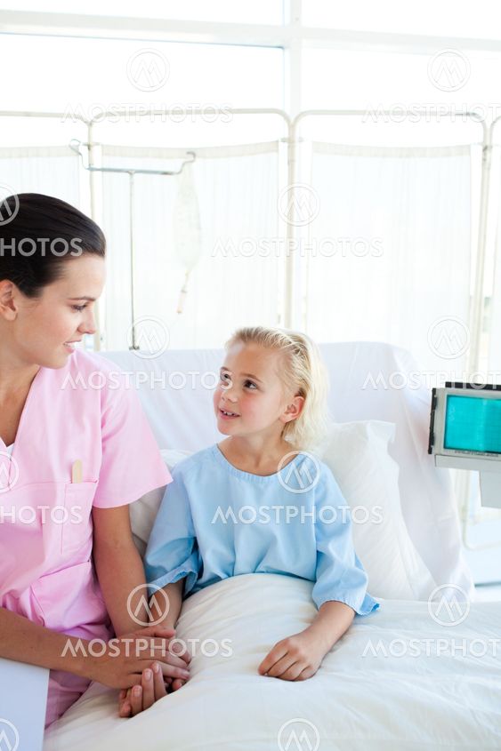 A nurse looking after a little girl