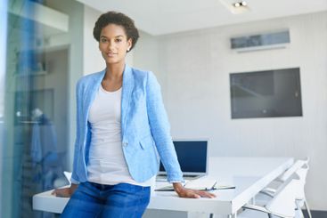 Portrait, professional and business woman in office for...