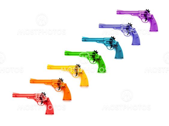 Toy plastic guns , on a white background