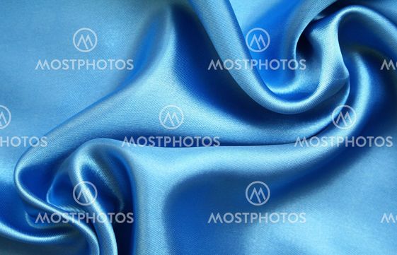 Smooth elegant blue silk as background
