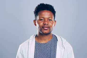 Black man, portrait and creative professional in studio,...