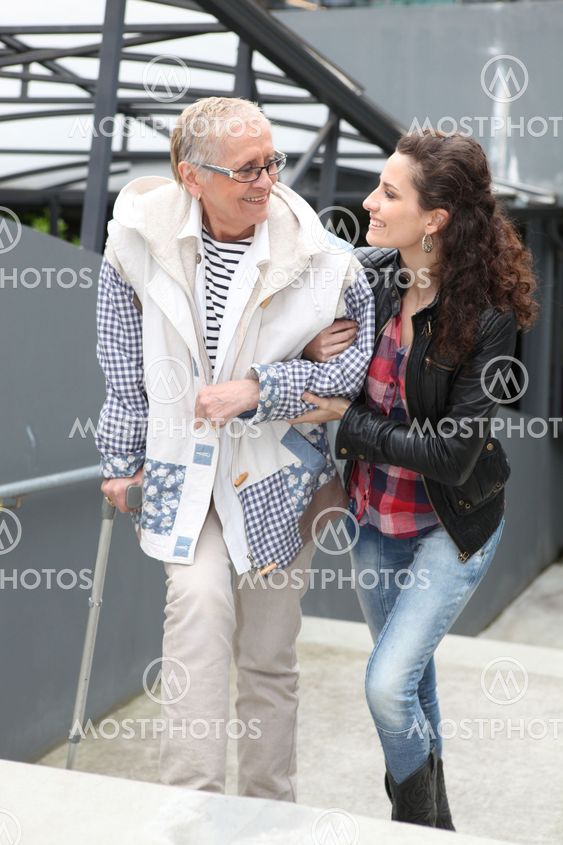 Girl helping older lady