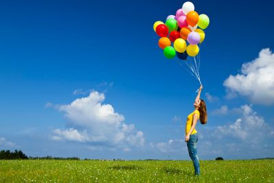 Girl with colorful balloons