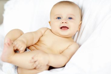 Baby, boy and smile on sofa, home and portrait with...