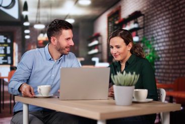 Coworkers Using Technology Lifestyle. Man And Woman...