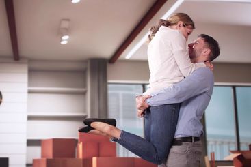 Happy Young Couple Moving Into New