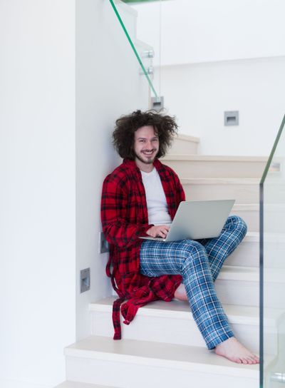 freelancer in bathrobe working from home