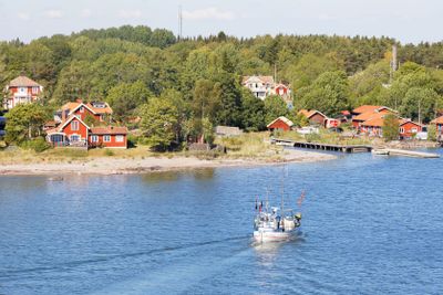 Small fishing boat heading back to the harbor in...