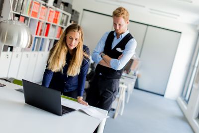 Young couple in office