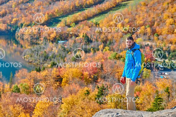Backpacker man at Artist's Bluff in autumn