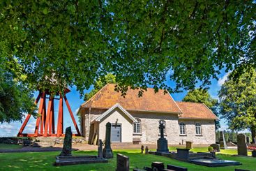 Church with belfry and cemetery in the Swedish countryside