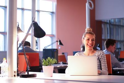 businesswoman using a laptop in startup office