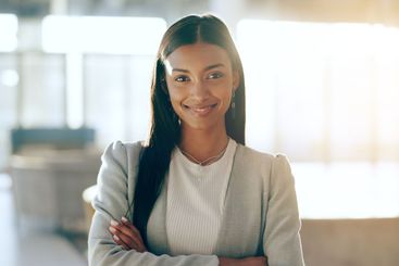 Businesswoman, smile and confidence with arms crossed in...
