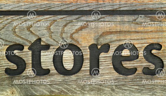 Old rusty wooden sign for store.