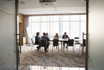 Corporate team engage in meeting or briefing event in...