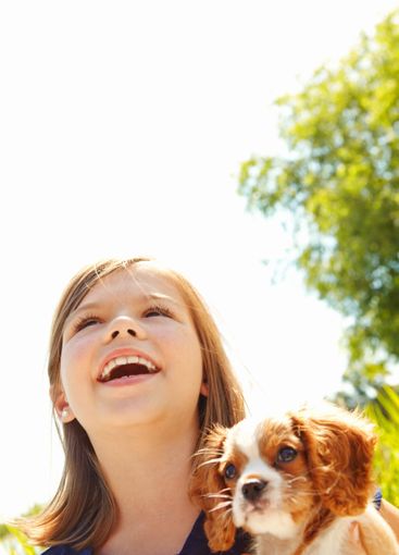 Happy, outdoor and kid with dog for bonding, connection...
